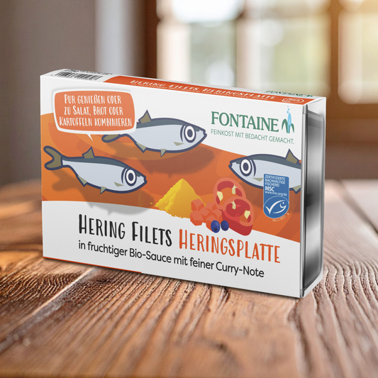 Eine Dose Heringsplatte auf dem Tisch