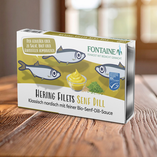 Eine Dose Hering Senf Dill auf dem Tisch